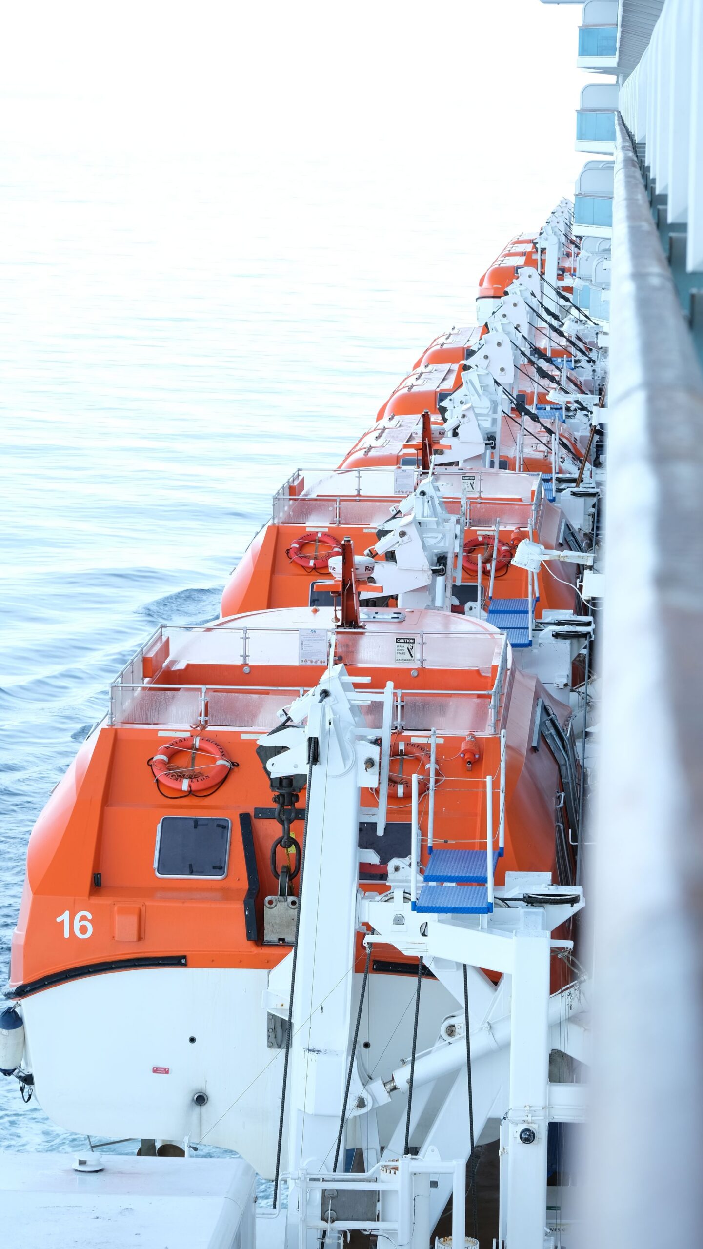 Lifeboats securely mounted on the deck of a cruise ship