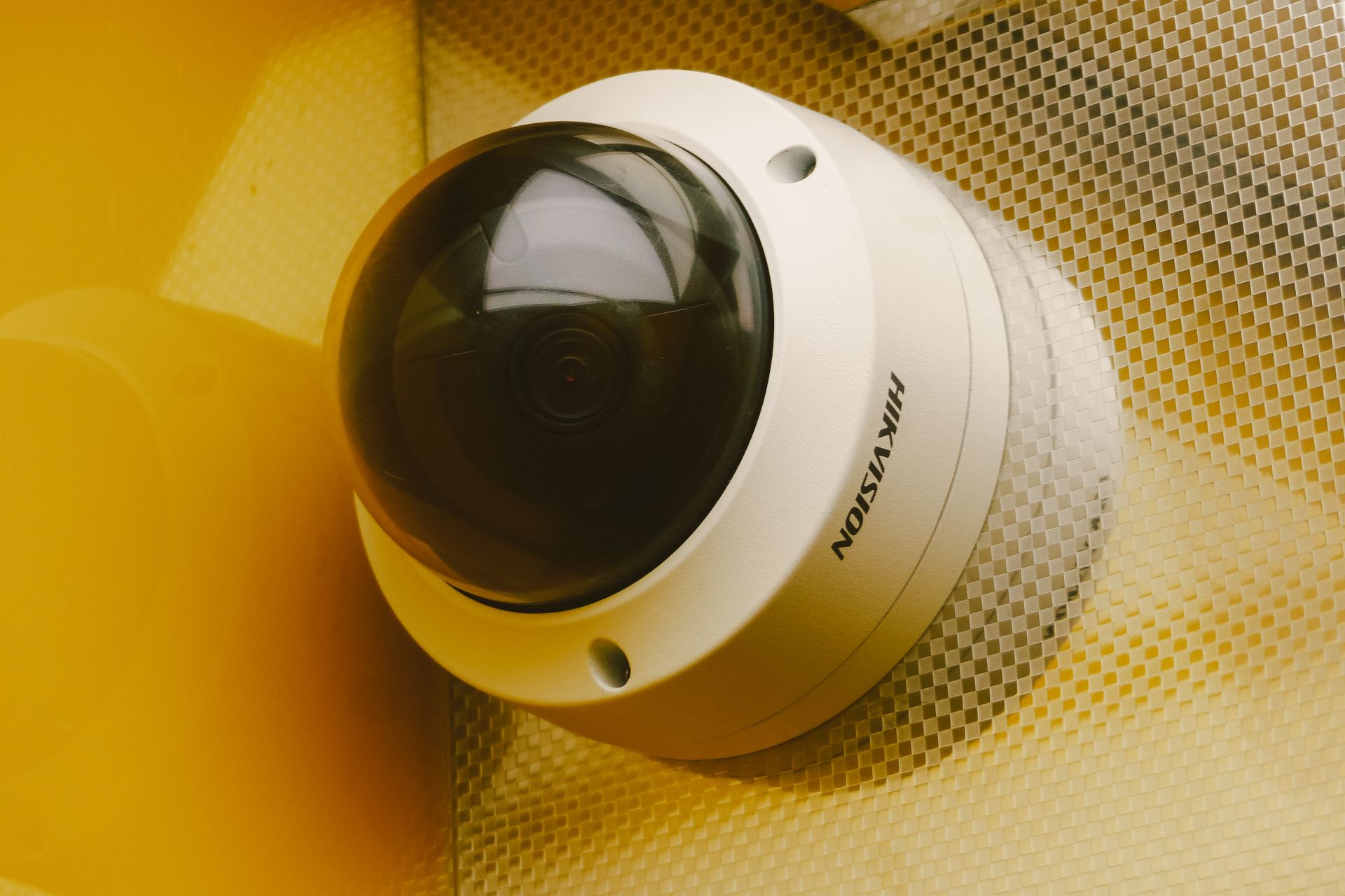 Modern dome security camera mounted in a building
