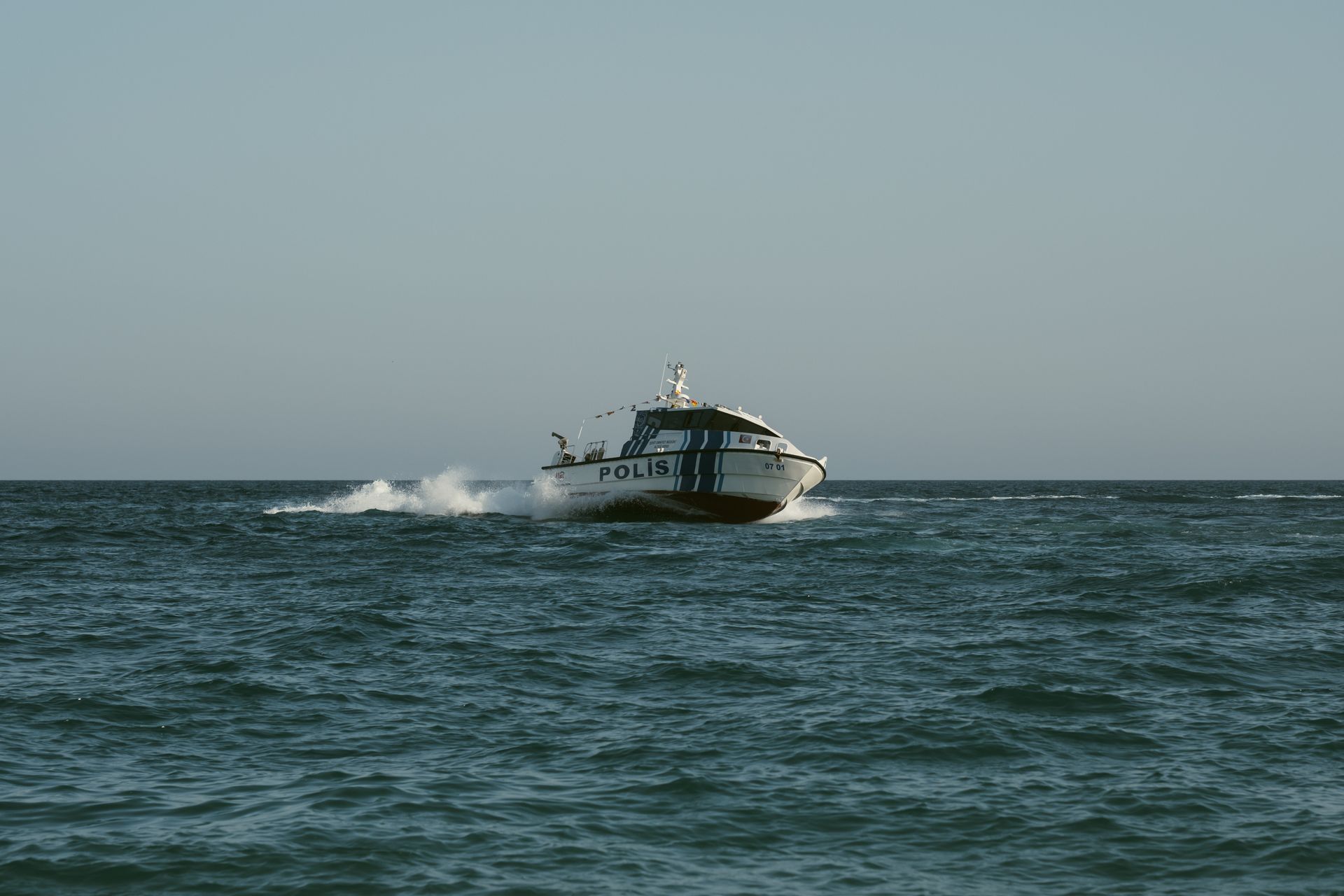 Patrol boat patrolling at sea during daytime