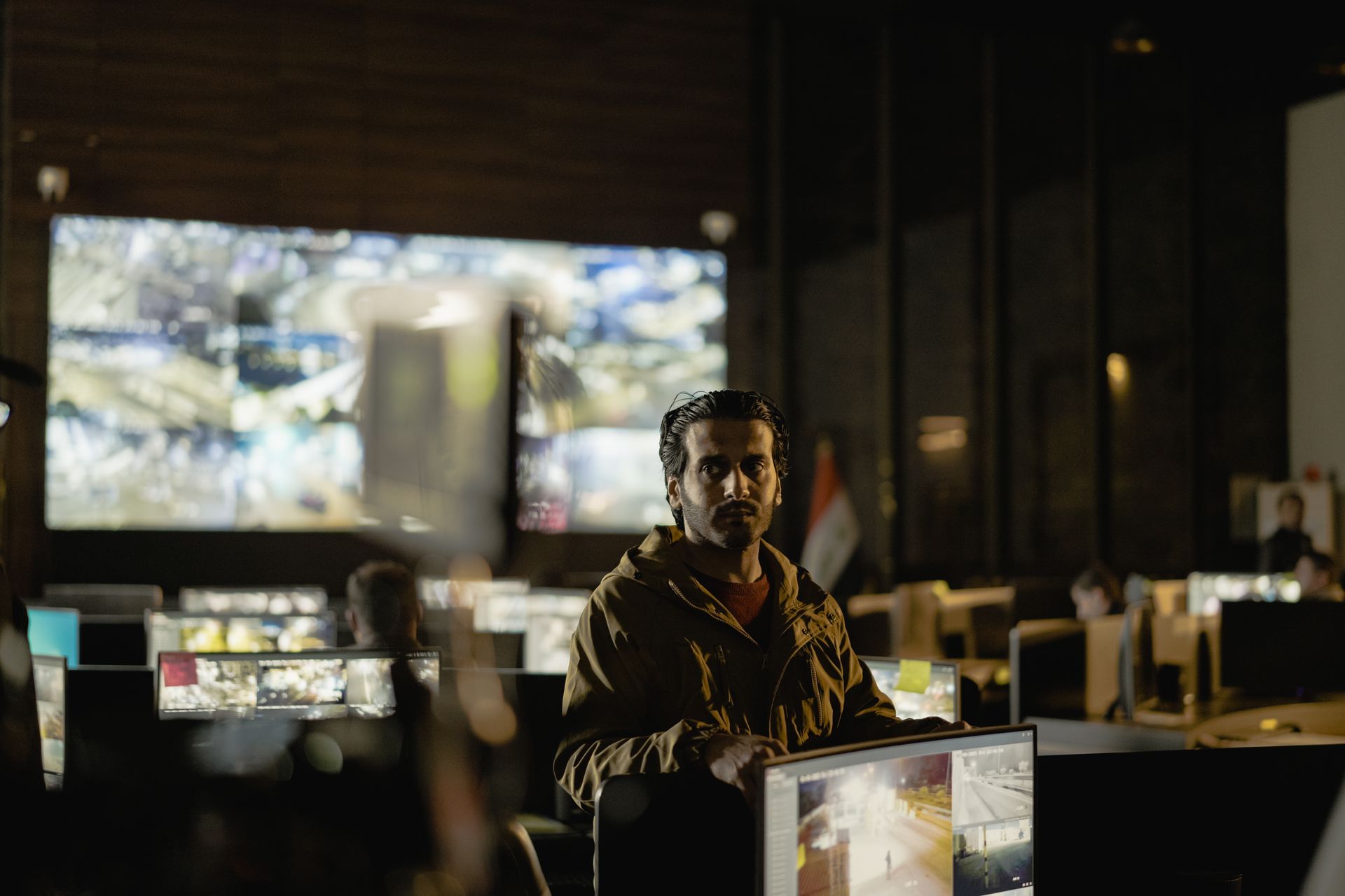 Security operations control room with team monitoring live surveillance feeds