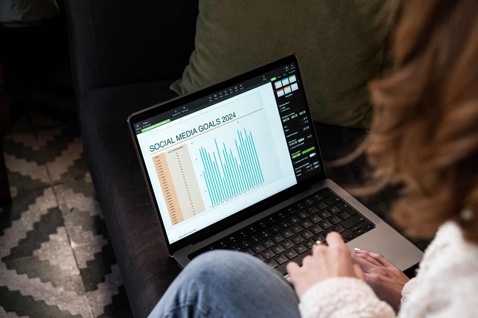 Woman reviewing social media analytics on a laptop