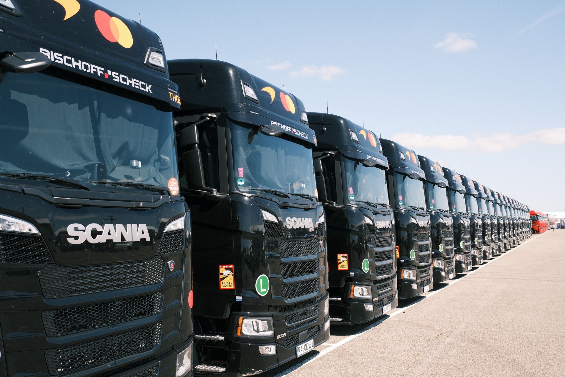 Fleet of company trucks lined up